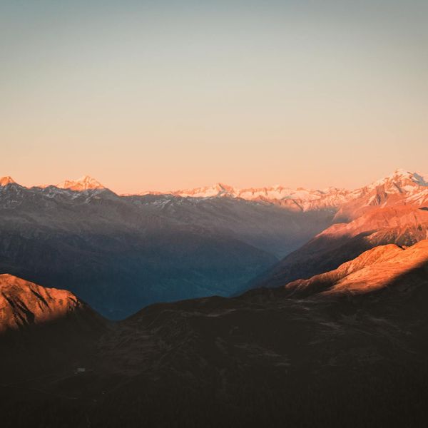 A clear, serene landscape of mountains at dawn, symbolizing clarity and peace.